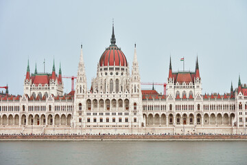 Poster - Hungarian Parliament with river Danube, front view. Famous landmark in Budapest. Beautiful architecture with historical building