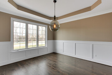 Wall Mural - Luxury Empty Modern Dining Area with Beautiful Dark Floors and Unique Ceiling Trim