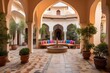 Indian courtyard in the traditional style, with a central courtyard surrounded by arched walkways, vibrant tiles, and potted plants