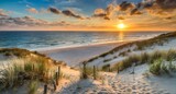 Fototapeta Zachód słońca - sunset over the beach .  Sunset at the dune beach