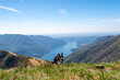 Landscape of Lake Como from Colmegnone mountain with a dog running