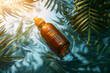 A bottle of aromatherapy essential oil in water with tropical palm leaves in sunlight