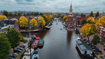 Wall Mural - Aerial drone view Amsterdam autumn cityscape narrow old houses, canals, boats bird's eye view