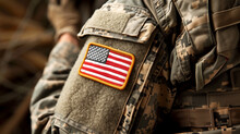 Element Of A Military Uniform, Visible Soldier's Arm With The US Flag Sewn On The Uniform.