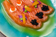 Gourmet meal salmon with caviar and green oil