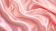 The pink silk satin in wavy folds creased texture background.