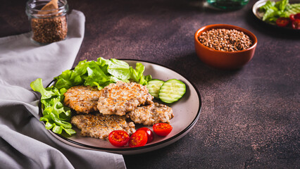 Wall Mural - Spicy buckwheat pancakes with slices of cucumber, tomato and lettuce on a plate web banner