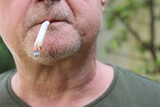 Fototapeta  - Ein Mann raucht einen Joint