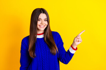 Sticker - Photo portrait of pretty teen girl point empty space wear trendy knitwear blue outfit isolated on yellow color background