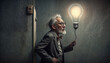 Old man with a light bulb instead of his head standing in a dark room