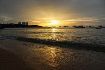 Wall Mural - Beaches in Asia, Thailand, Pattaya, the sea at the time of sunset on the beach