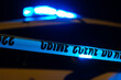 Police lights and crime scene tape