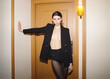 elegance beauty brunette woman in black blazer in luxury hotel interior, quiet luxury