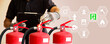 Hand checking fire extinguisher with fire protection icons for fire prevention protect and prevent and safety rescue or use of equipment on fire training concept.