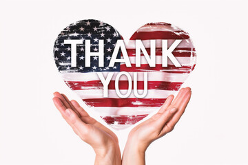 Hands holding thank you heart with american flag on white background
