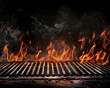 Flaming empty barbeque grill background with copy space, burning coals and flames 