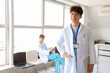 © Pixel-Shot - Portrait of male medical intern in clinic