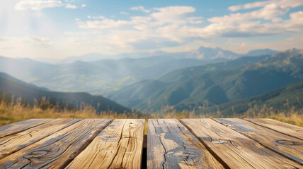 Empty wooden table top with blurred moutain field background for product display montage