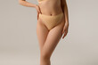 © looking2thesky - Fit and healthy. Beautiful female body on white background. Beauty, cosmetics, spa, depilation, diet and treatment, fitness concept. Fit and sportive, sensual body with well-kept skin in underwear.