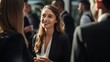 © CStock - businesswoman networking at a corporate event, engaging in conversation with clients and colleagues.