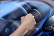© peopleimages.com - Hands, steering wheel and driving in car by window, vehicle and travel on commute or journey. Fingers, closeup of person and automobile to test drive or motor exam for license, navigate and route
