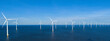 © Fokke Baarssen - offshore windmill park and a blue sky, windmill park in the ocean. Netherlands Europe. windmill turbines in the Noordoostpolder Flevoland