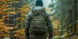 Rucking. Modern sport. Man walk around the forest with backpacks filled with weights: dumbbells, kettlebells. Muscle training, endurance and cardio. Techniques borrowed from military training