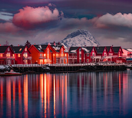 Wall Mural - red wooden houses on ballstad port, norway, europe. dramatic spring sunset on lofoten islands. calm 