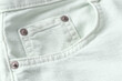 Close up of light mint jeans pocket,pastelt denim cotton fabric texture