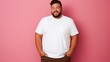 © Rachel Yee Laam Lai - joyful young hispanic plus size body positive male man boy guy 30s in white blank design casual t-shirt posing color background studio portrait, ai