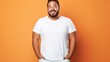 joyful young hispanic plus size body positive male man boy guy 30s in white blank design casual t-shirt posing color background studio portrait, ai
