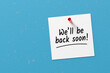 © Cagkan - The message we will be back soon written on a note paper