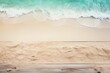 Beach sand and mint green wooden background with copy space for summer vacation concept, text on the right side