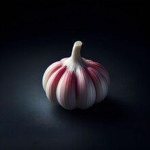 Garlic On A Black Surface With A Dark Background