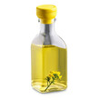 Canola oil in a clear glass bottle with a single canola flower on a transparent
