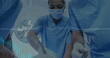 Image of rotating dna over caucasian female anesthesiologist using smartphone