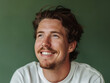 © Amy - Studio Portrait of a Happy Man with Facial Hair Against a Green Background