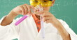 Digital composite of a little boy mixing chemicals with equations and graphs in the foreground
