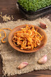 Fresh Cordyceps militaris mushrooms on brown wooden. Side view