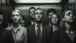 Monochrome shot of individuals in the elevator