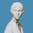 Woman statue, female Greek goddess sculpture 3d rendering isolated on blue background
