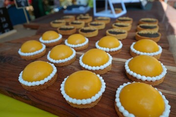 Wall Mural - Close-up shot of glazed sugar cookies on a wooden table