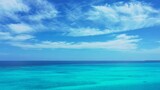 Fototapeta Na sufit - Scenic view of a turquoise sea on a sunny day