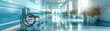 © Atchariya63 - Hospital corridor with empty wheelchair, Lud panoramic, serene atmosphere, room for text
