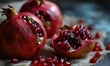 A close up of a pomegranate with seeds and some pieces cut out. AI.