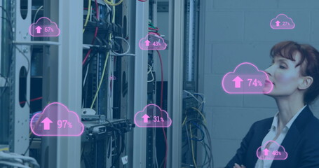 Canvas Print - Image of clouds icons over caucasian female worker inspecting server room