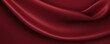 Maroon background with subtle grain texture for elegant design, top view. Marokee velvet fabric backdrop with space for text or logo