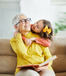 © Lumos sp - grandchild family child grandparent grandmother book reading elderly granddaughter girl happy together read learning education story fun leisure teaching storytelling senior smiling kiss hug
