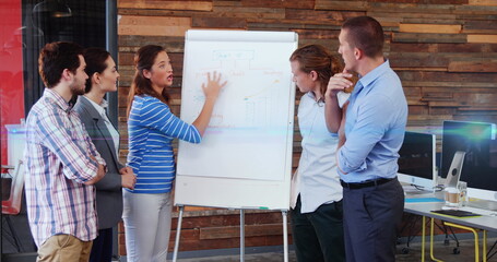 Wall Mural - Image of light spots over caucasian business people in office