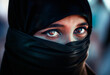 Niqab and burka. Arab woman wearing burqa. Eyes, black scarf covering face. Hijab headscarf or veil. Islam in Middle East. Saudi Arabian or Iranian. Portrait of sad unhappy lady. Afghanistan or Iraq.